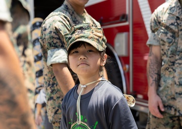 Kamimotobu After-School Children’s Club students tour Camp Schwab