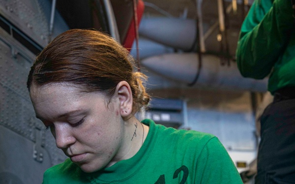 Sailors Conduct Aircraft Maintenance in the Hangar Bay Aboard George Washington