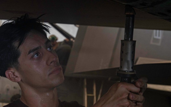 Sailors Conduct Aircraft Maintenance in the Hangar Bay Aboard George Washington