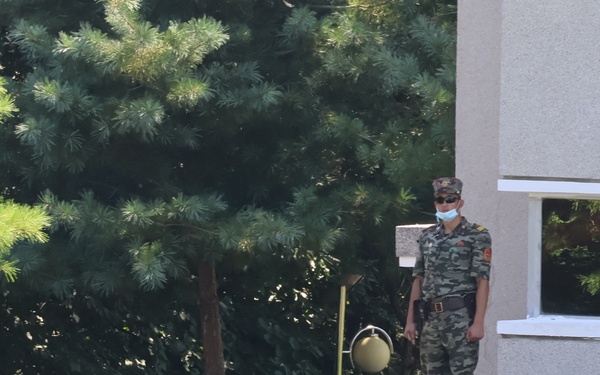 KPA soldier observes south-side personnel