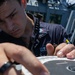 USS Mitscher (DDG 57) Sailor conducts bridge maintenance