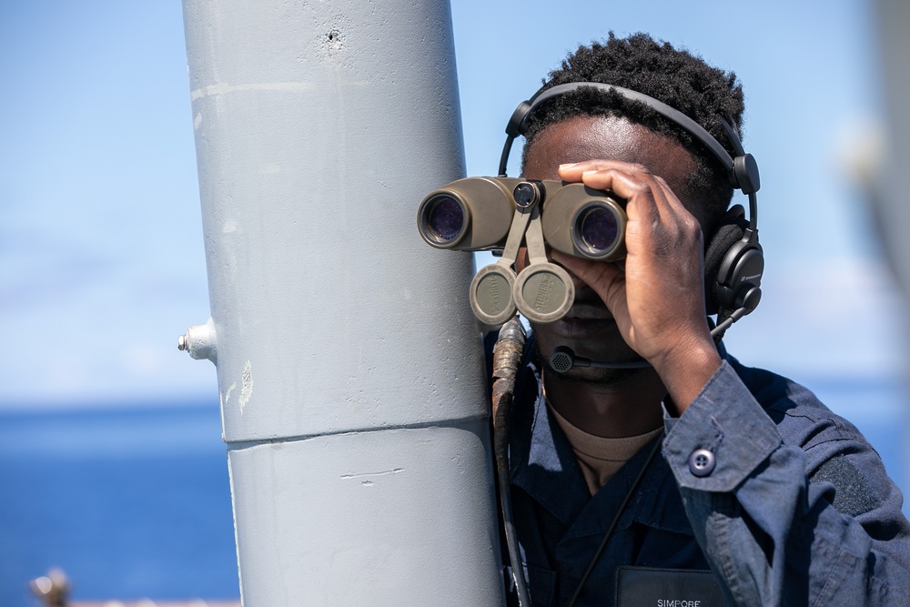 USS Mitscher (DDG 57) Sailor stands aft lookout