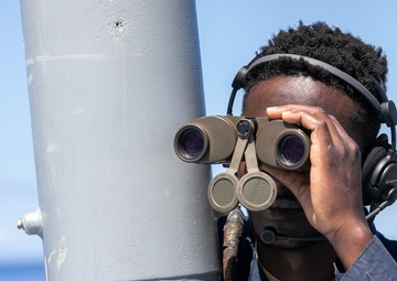 USS Mitscher (DDG 57) Sailor stands aft lookout