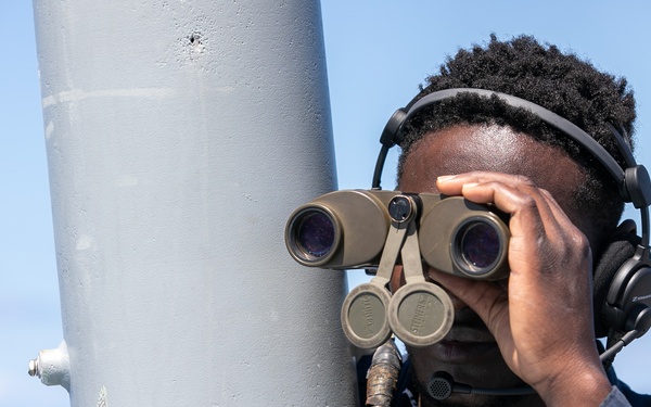 USS Mitscher (DDG 57) Sailor stands aft lookout