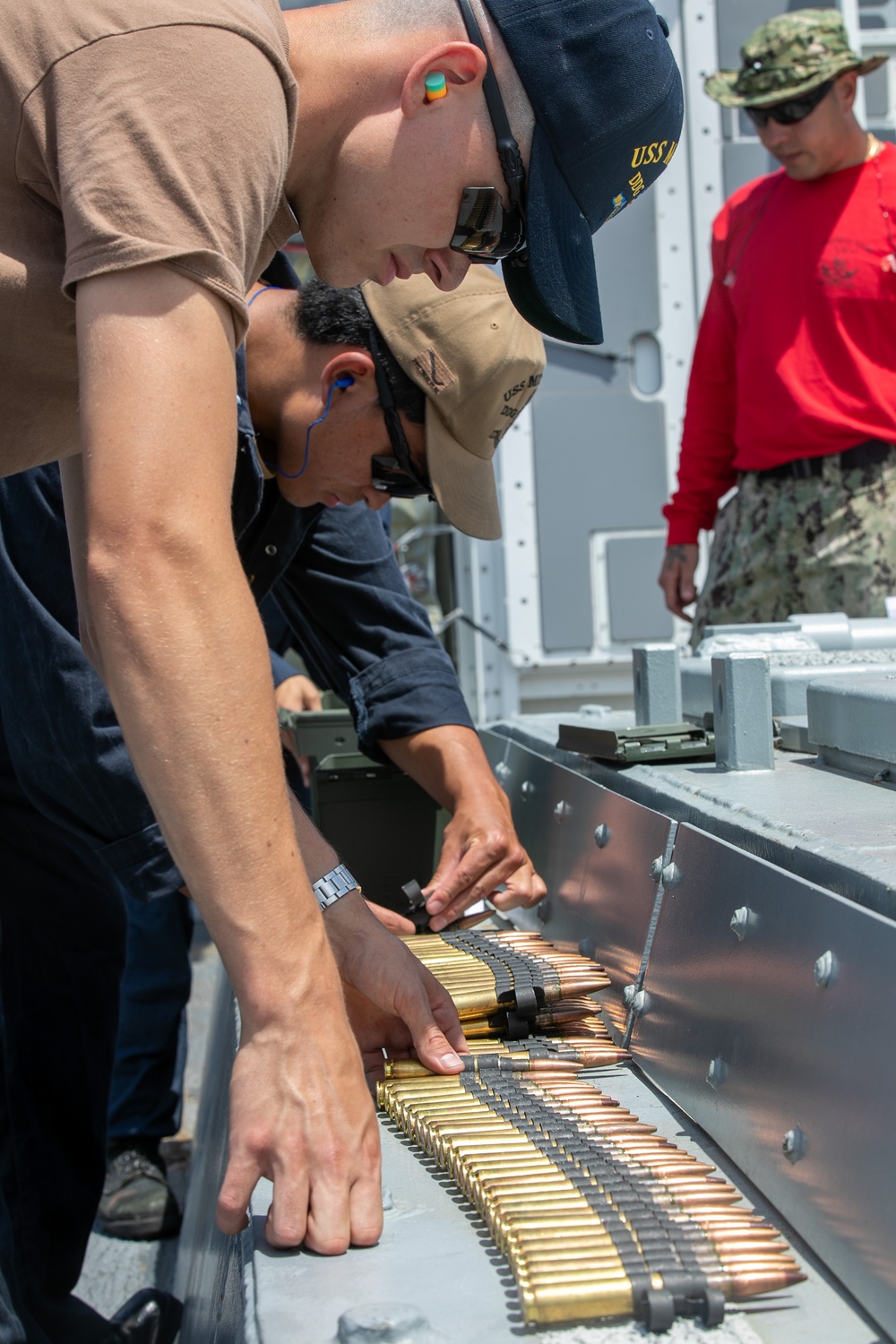 USS Mitscher (DDG 57) Sailors conduct small arms live fire exercise
