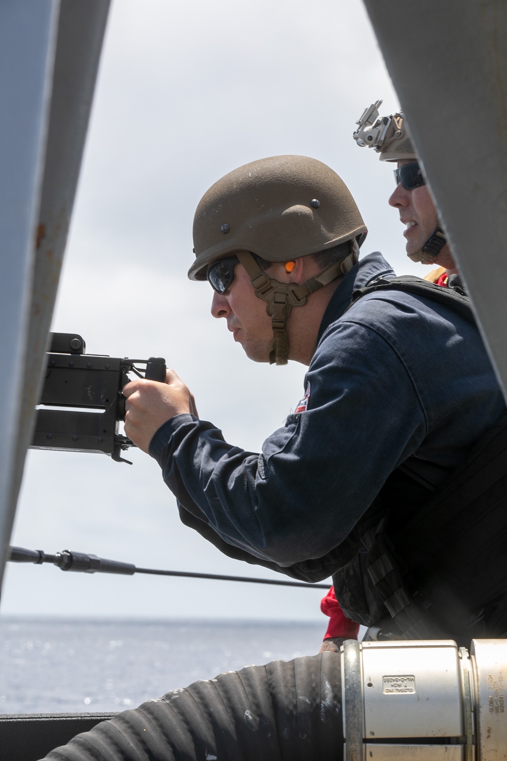 USS Mitscher (DDG 57) Sailors conduct small arms live fire exercise