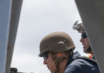 USS Mitscher (DDG 57) Sailors conduct small arms live fire exercise