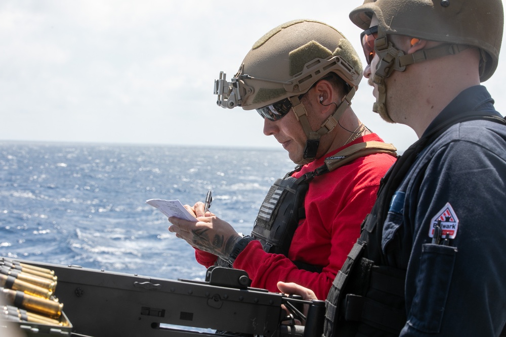 USS Mitscher (DDG 57) Sailors conduct small arms live fire exercise
