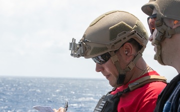 USS Mitscher (DDG 57) Sailors conduct small arms live fire exercise