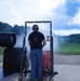A test engineer manually fires the GAU-21 machine gun