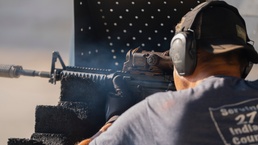 A test engineer manually fires the M4A1 machine gun,