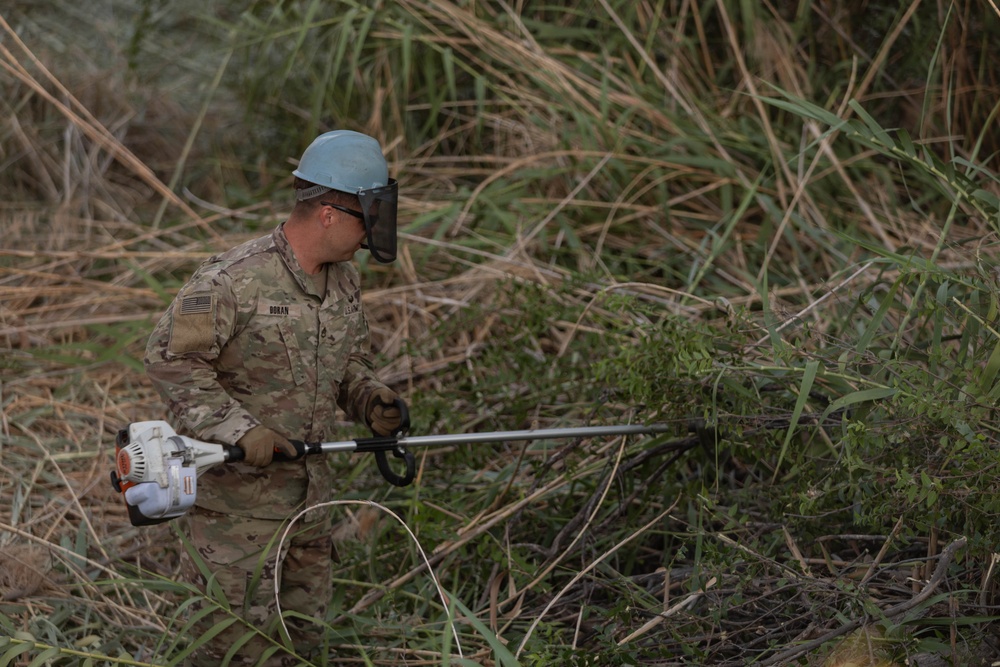 U.S. Soldiers conduct brush clearing operations to support U.S. Border Patrol