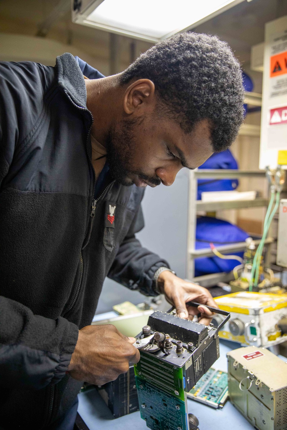 USS Gerald R. Ford (CVN 78) Sailor Conducts Maintenance