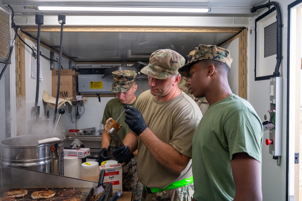 131st Bomb Wing Airmen practice interoperability with Marines in expeditionary kitchen