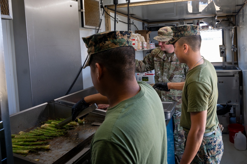 131st Bomb Wing Airmen practice interoperability with Marines in expeditionary kitchen