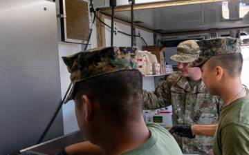131st Bomb Wing Airmen practice interoperability with Marines in expeditionary kitchen