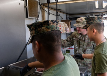 131st Bomb Wing Airmen practice interoperability with Marines in expeditionary kitchen