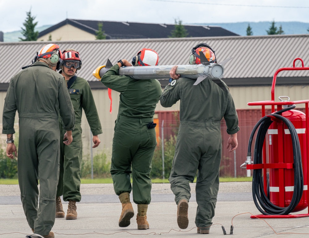 U.S. Marines load ordnance during Red Flag Alaska
