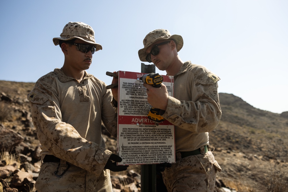 Marines place signs at Yuma NDA