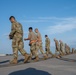 Maintenance Airmen sweep flightline for FOD