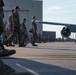 Maintenance Airmen sweep flightline for FOD