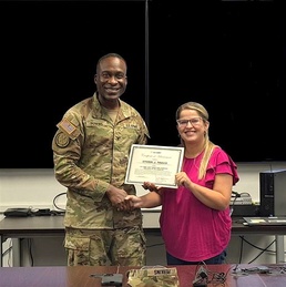 ‘I’m not afraid to break the mold’: MCAAP’s Travis earns JMC Employee of Quarter award