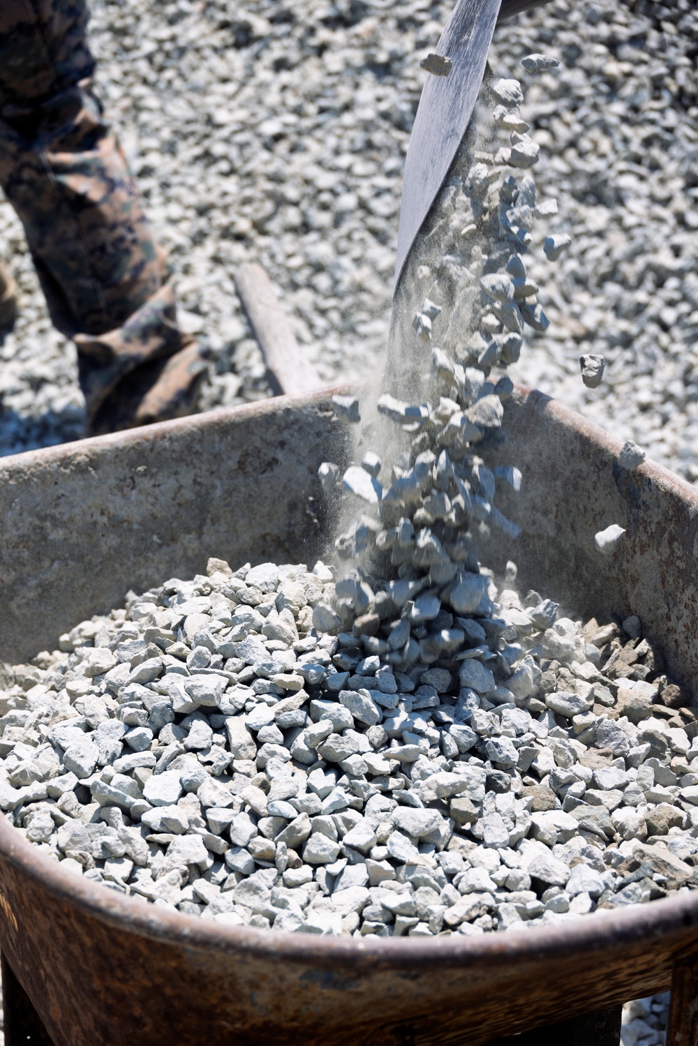 Marines and Sailors lay out rocks with a non-federal entity