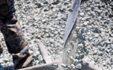 Marines and Sailors lay out rocks with a non-federal entity