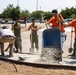 Marines and Sailors lay out rocks with a non-federal entity