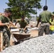Marines and Sailors lay out rocks with a non-federal entity