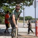 Marines and Sailors lay out rocks with a non-federal entity