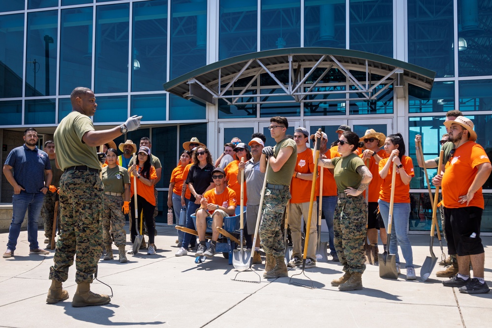 Marines and Sailors lay out rocks with a non-federal entity