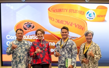 Cmdr. Michael John Encina Padua awarded the DKI APCSS Fellows Project Laulima lanyard
