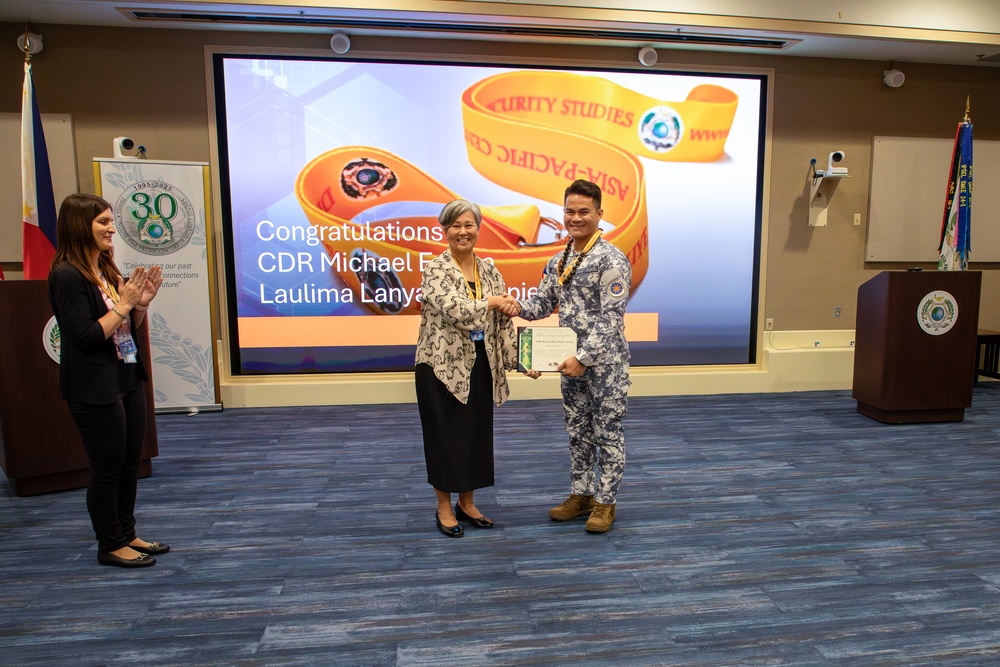 Cmdr. Michael John Encina Padua awarded the DKI APCSS Fellows Project Laulima lanyard
