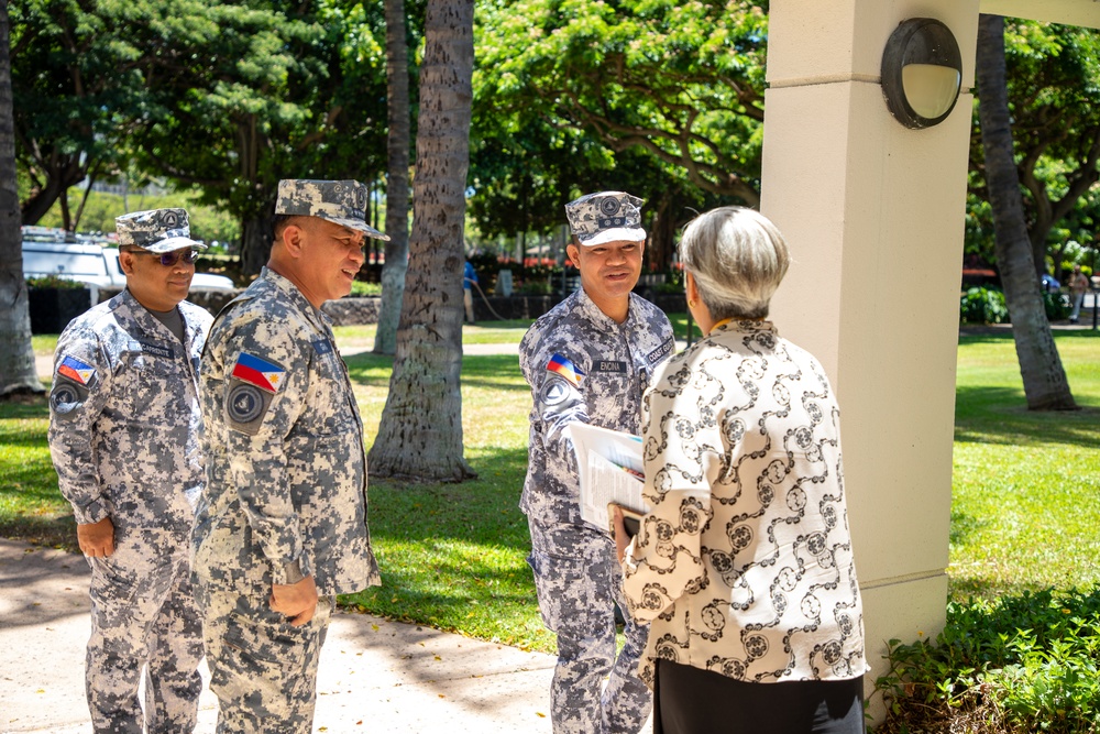 Cmdr. Michael John Encina Padua awarded the DKI APCSS Fellows Project Laulima lanyard