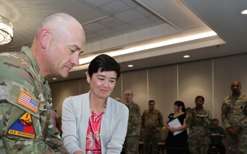 403rd AFSB commander Col. Henry Brown relinquishes command to Col. Jason Book in change of command ceremony
