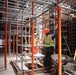 Construction Crew Prep A Worksite Under Scaffolding