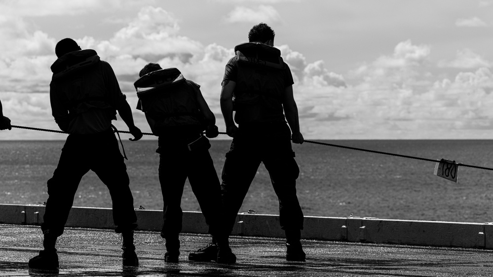 George Washington Sailors Conduct Replenishment-at-Sea with Alan Shepard