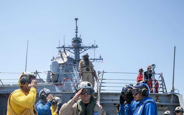USS Mitscher (DDG 57) renders honors to Commander, CSG 12
