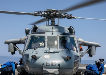 USS Mitscher (DDG 57) Sailors conduct flight quarters with HSC 9