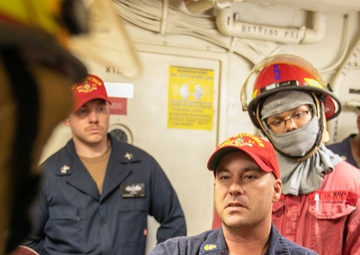 USS Mitscher (DDG 57) Sailors conduct damage control training