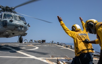 USS Mitscher (DDG 57) Sailors conduct flight quarters with HSC 9