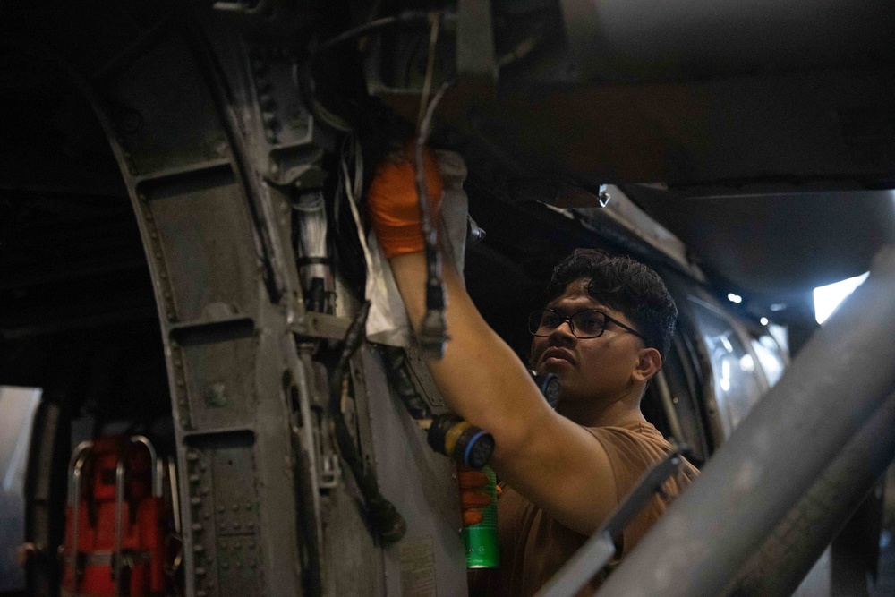HSC-9 Sailor Conducts Maintenance