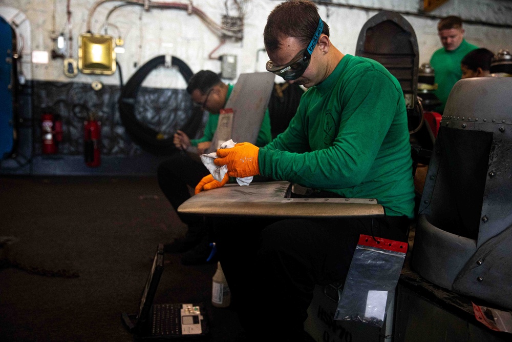 HSM-70 Sailor Conducts Maintenance