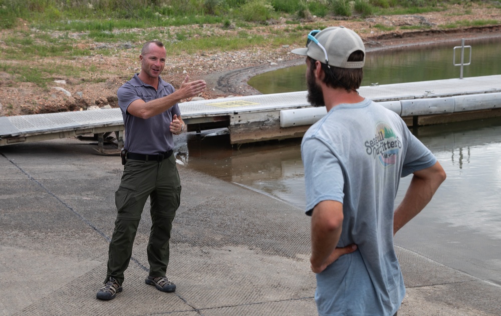 Garrison Dam team meets a paddling pal