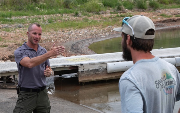 Garrison Dam team meets a paddling pal