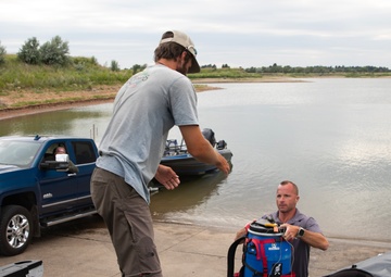 Garrison Dam team meets a paddling pal