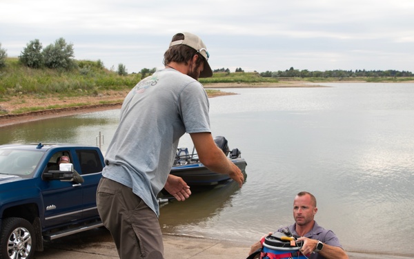 Garrison Dam team meets a paddling pal