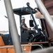 U.S. Marines receive cargo from USNS Guam