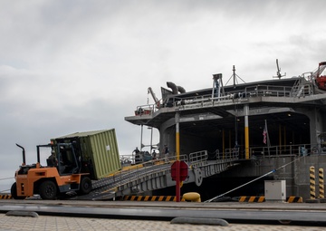 U.S. Marines receive cargo from USNS Guam